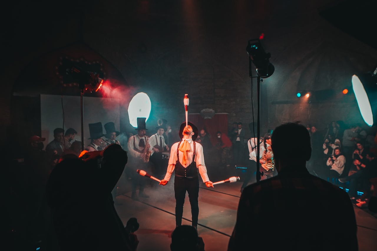 Crafting Captivating Headlines: Your awesome post title goes here A mesmerizing circus juggler performs under dramatic lighting during a lively festival.