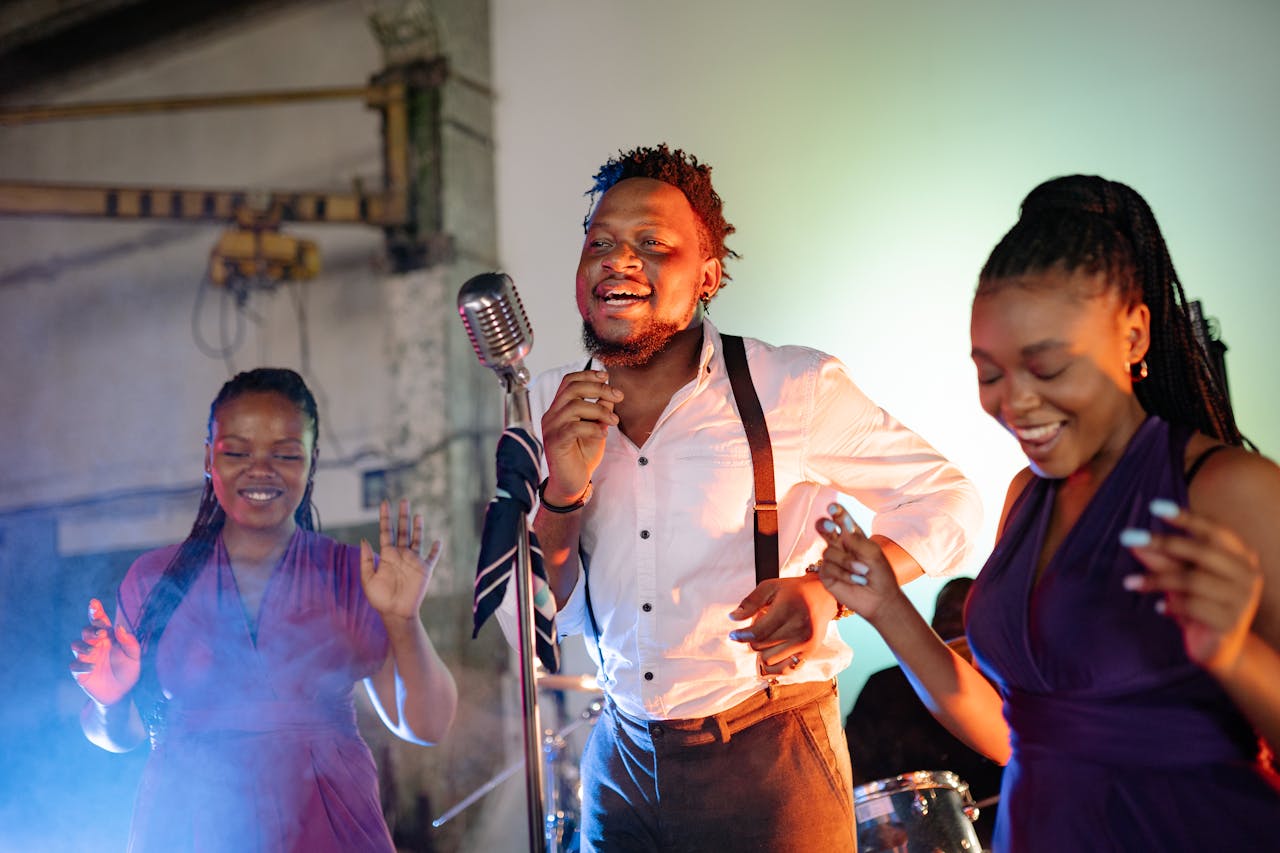 The Art of Drawing Readers In: Your attractive post title goes here A lively group of adults singing and dancing with a vintage microphone indoors.